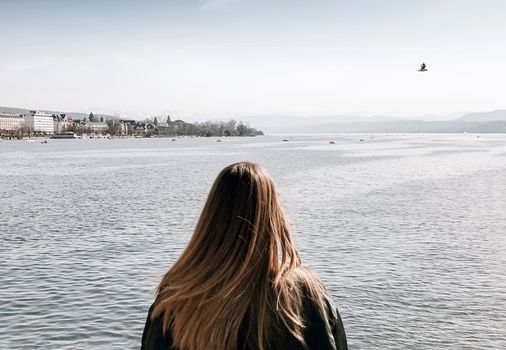 Woman looking at Zurich lake