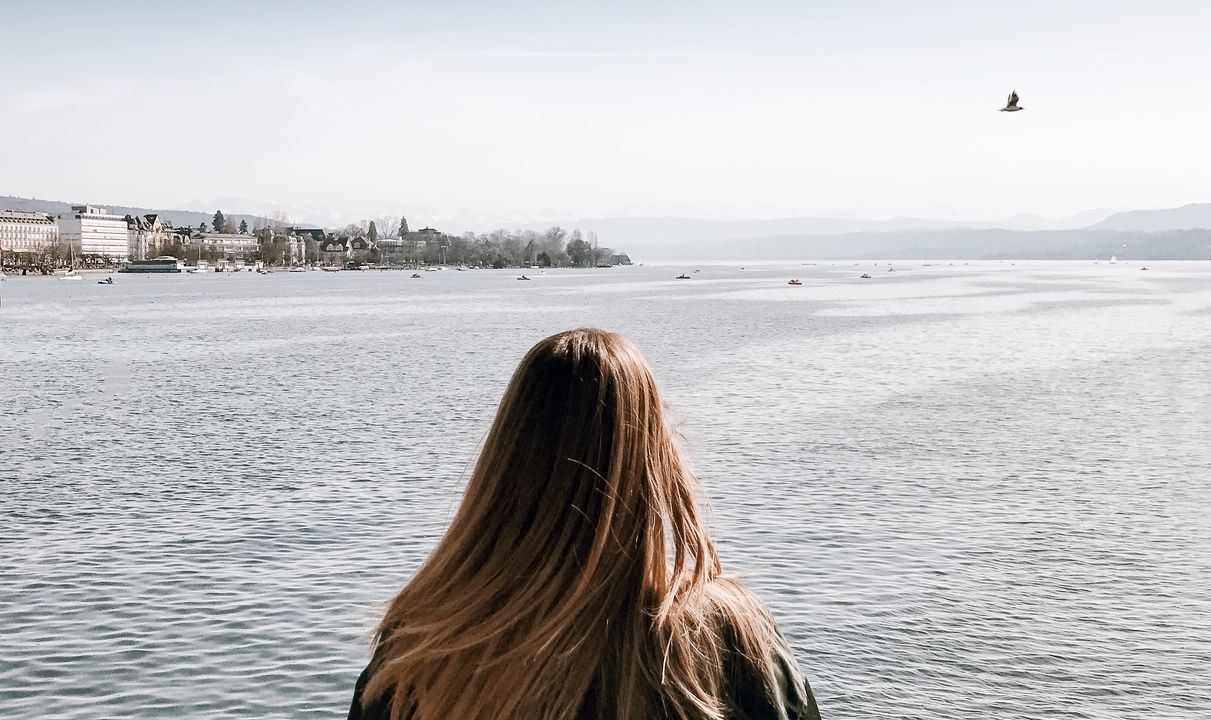 Woman looking at Zurich lake
